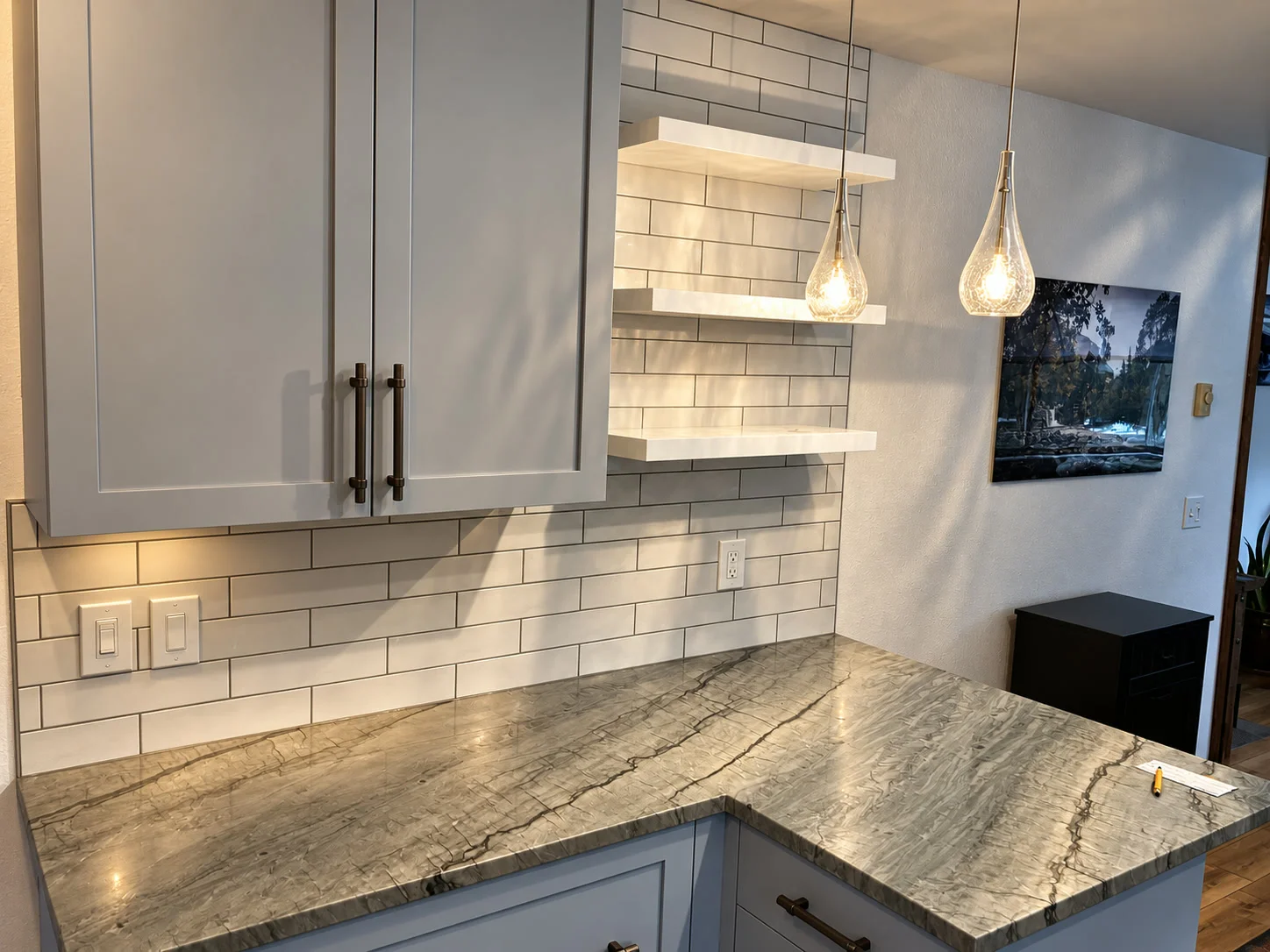 Exotic granite kitchen countertop with white subway tile backsplash