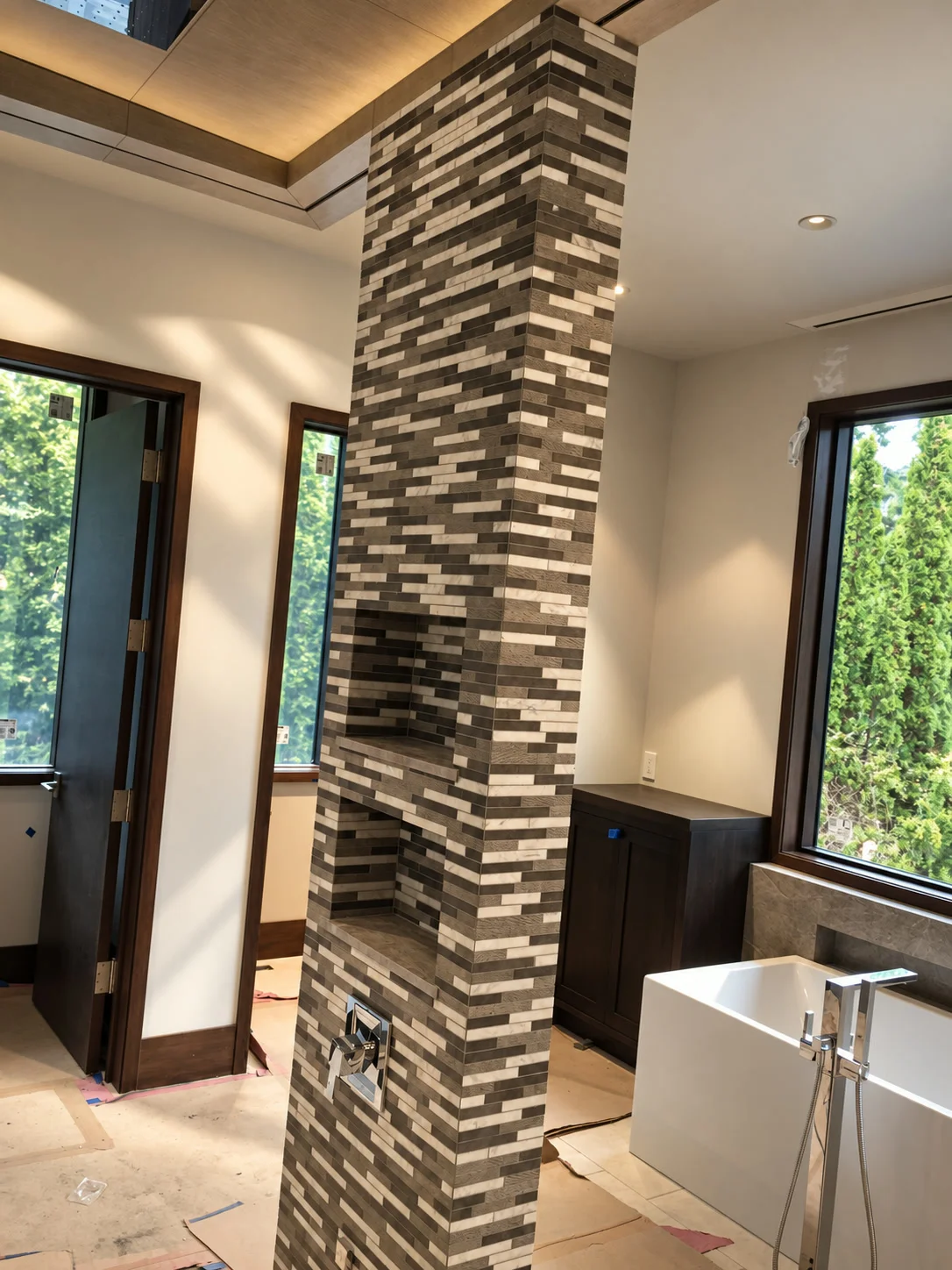 Bathroom architectural stone mosaic column and freestanding tub